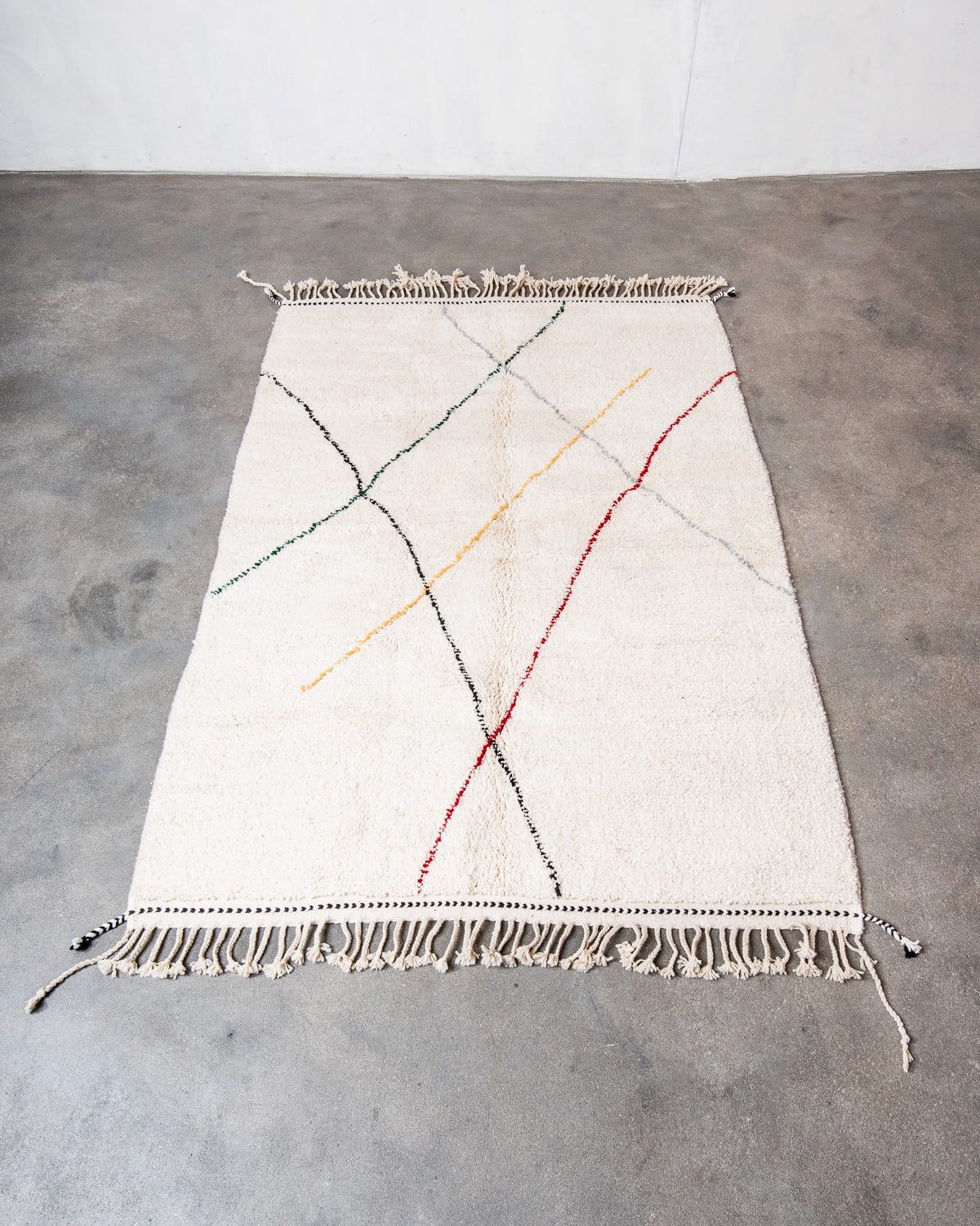 Modern, designer, handcrafted Berber rug from Morocco. Beniourain carpet with beautiful colours and patterns and fluffy wool texture.